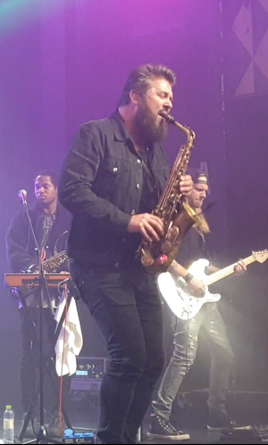 Edinger performing with The Midnight in 2019